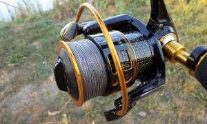 How to fix the reel on the rod so that it holds securely Installing the fishing line on a spinning reel